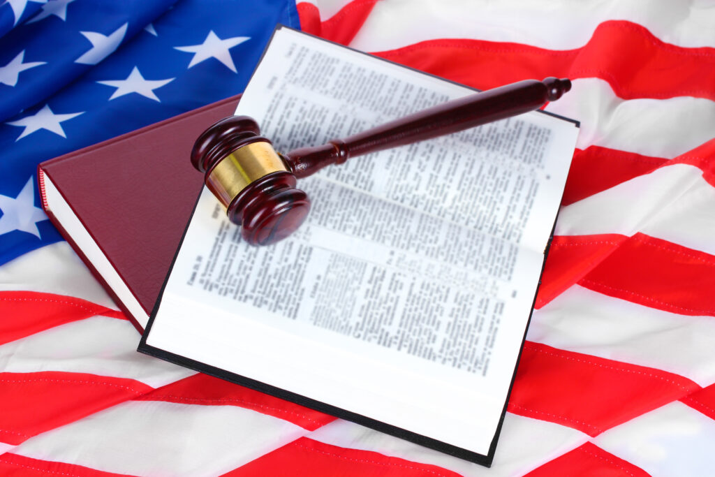 judge gavel and books on american flag background